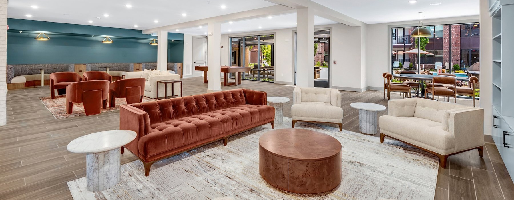 a clubroom with couches, tables and chairs