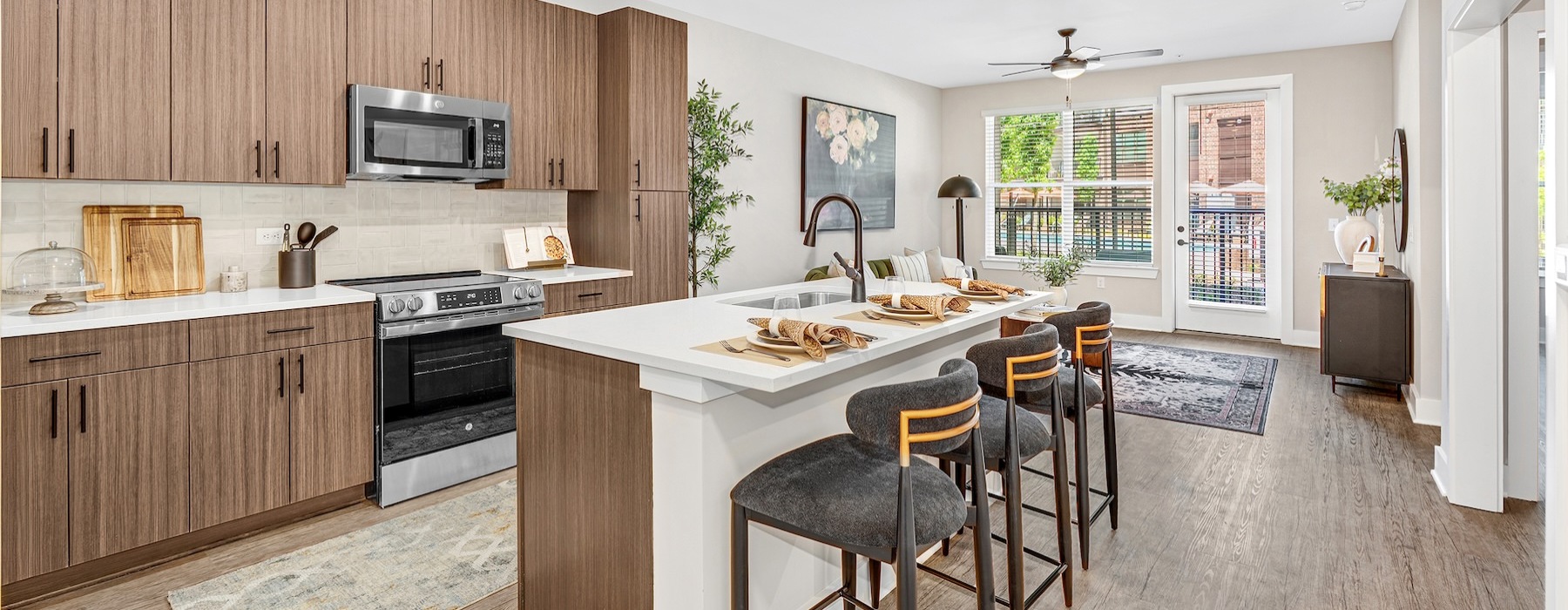 a kitchen with an island and chairs