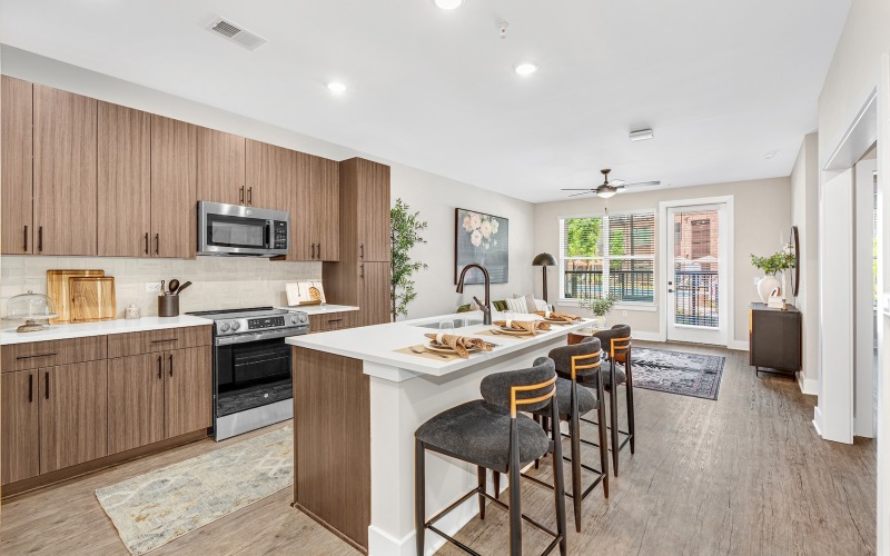 a kitchen with an island and chairs