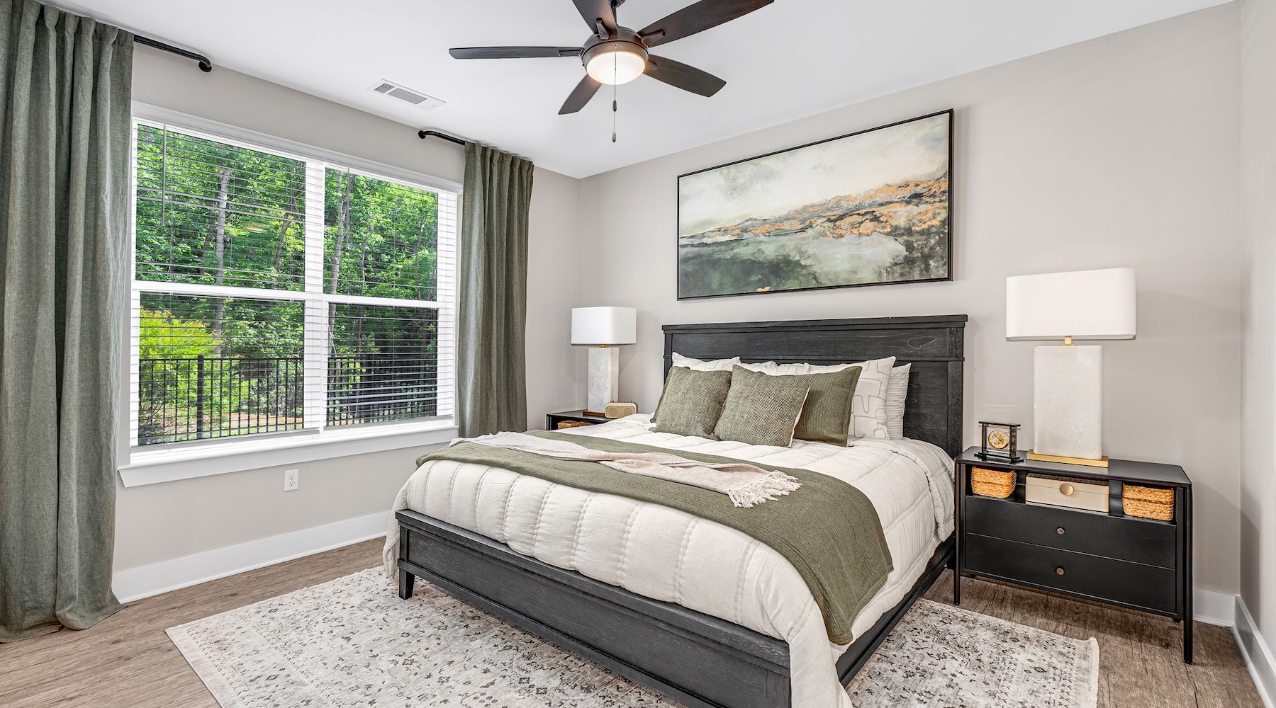 a bedroom with a bed and two nightstands