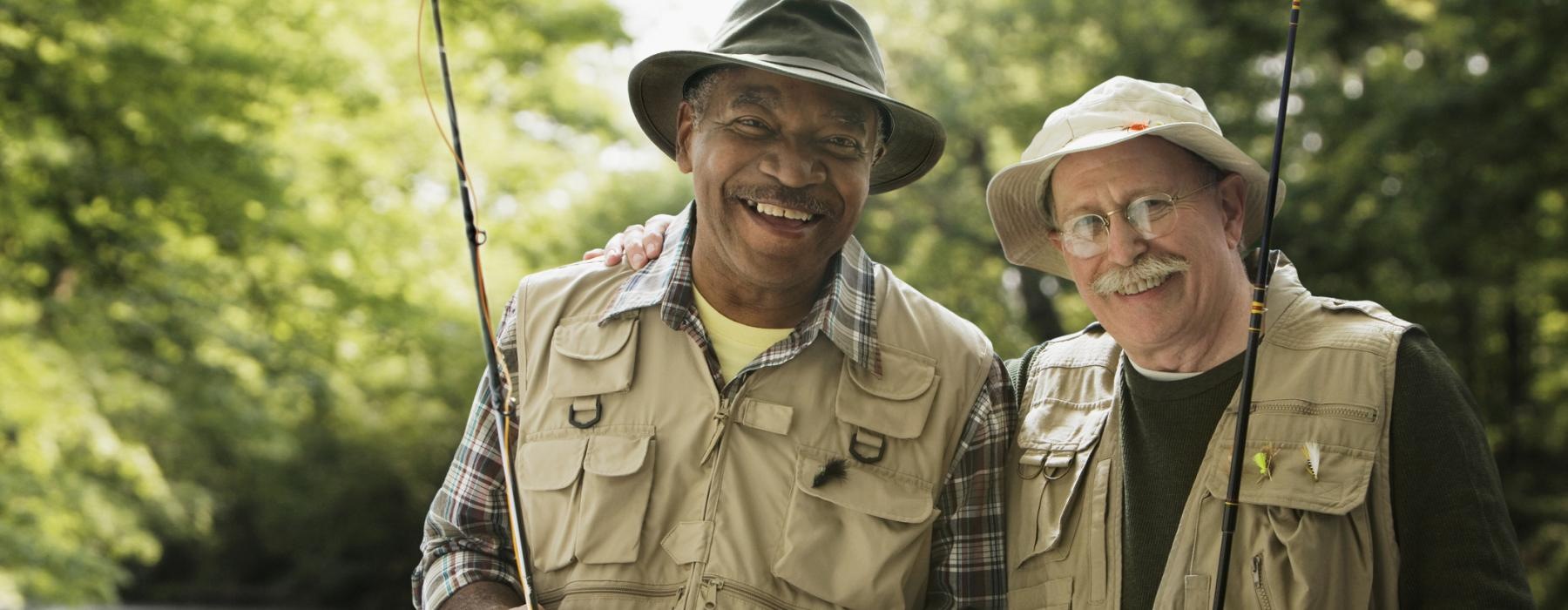 a couple of men smiling