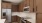 a kitchen with wooden cabinets