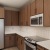 a kitchen with wooden cabinets