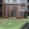 The outdoor lounge at Weller at the Preserve senior apartments in Asheville, NC, featuring a view of the apartment exteriors.