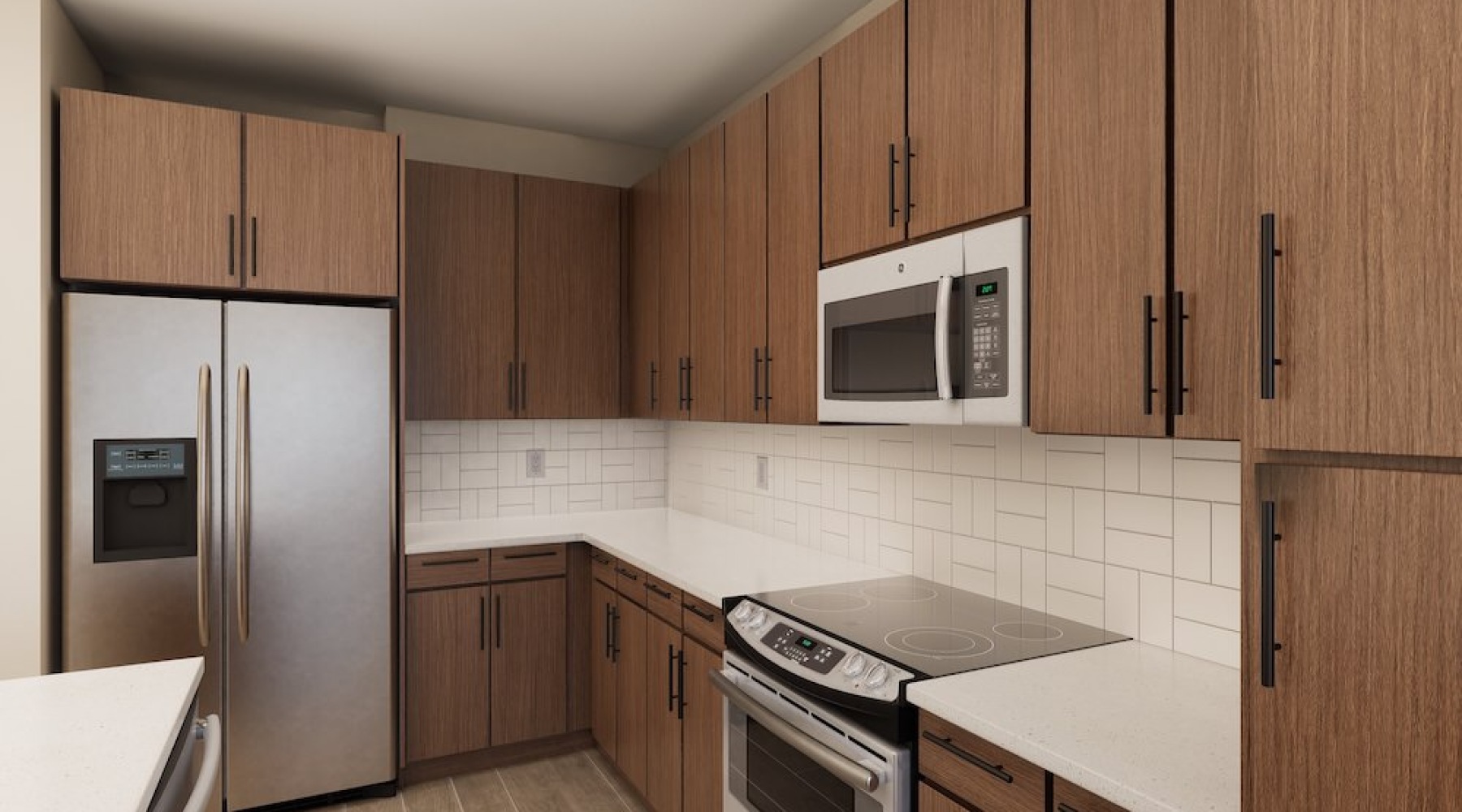 Model kitchen at Weller at the Preserve senior apartments in Asheville, featuring tiled backsplash and wood grain cabinets.