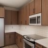 a kitchen with wood cabinets