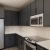 a kitchen with black cabinets