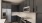 a kitchen with black cabinets
